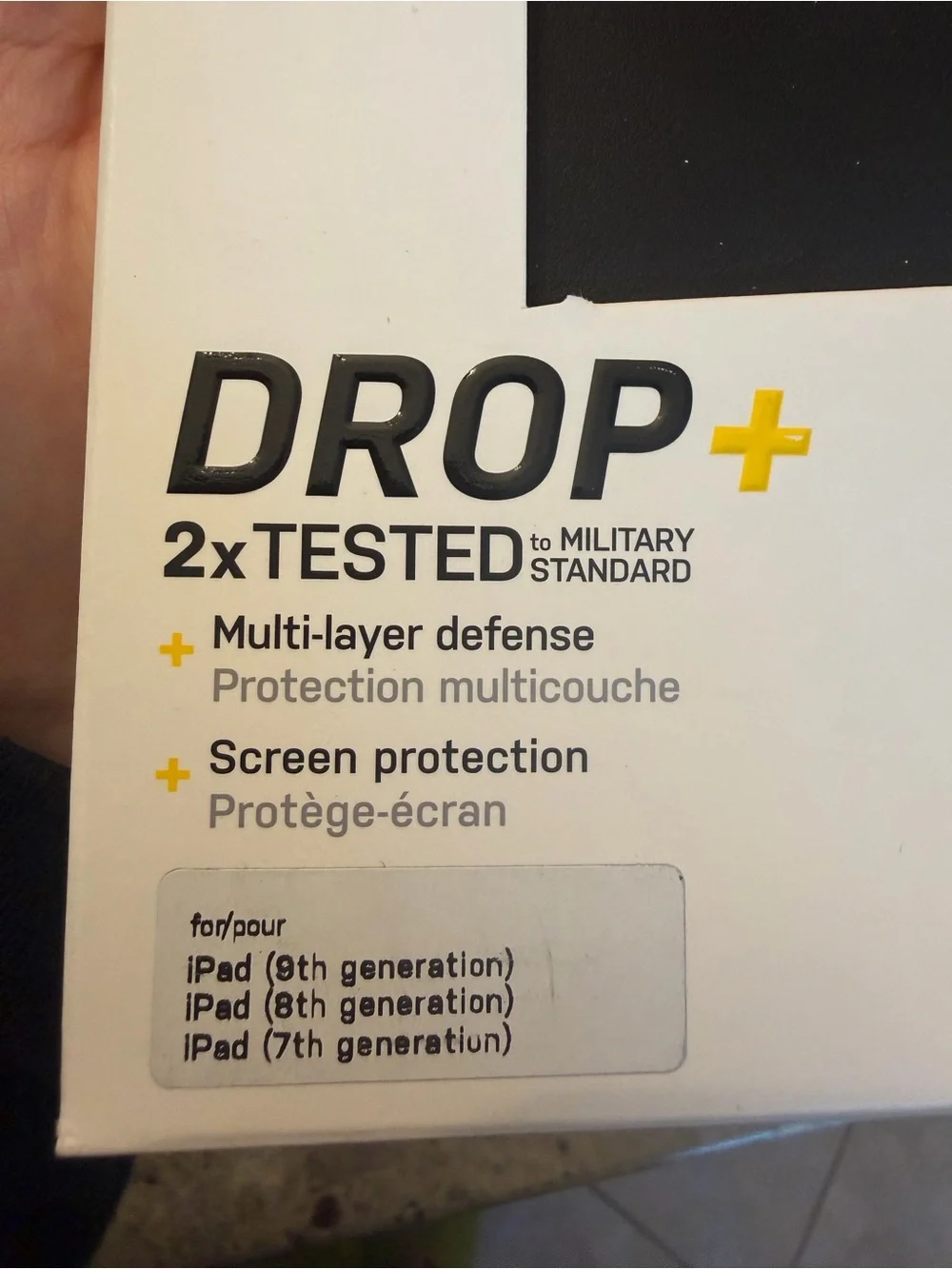 OtterBox iPad Case Packaging in Black and White with Yellow Accent